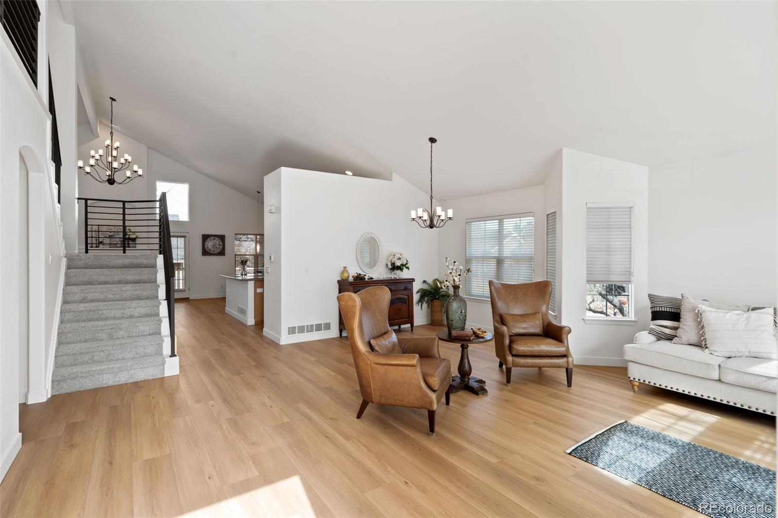 9838 Cypress Point Circle Lone Tree, CO 80124 - Photo 9 of 50 a living room with furniture and wooden floor