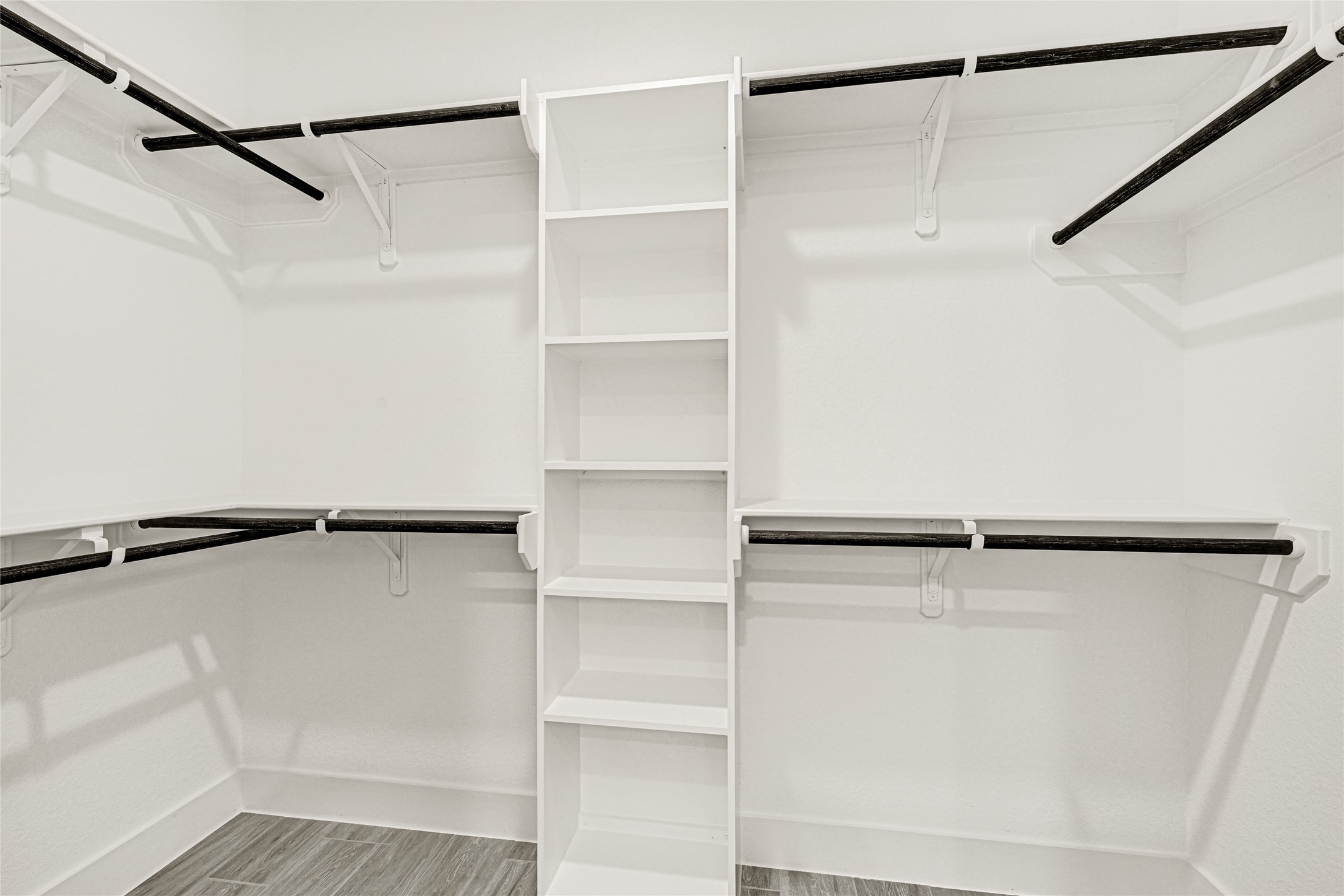 515 Fairfax Lane Conroe, TX 77303 - Photo 14 of 26 a view of walk in closet with empty racks