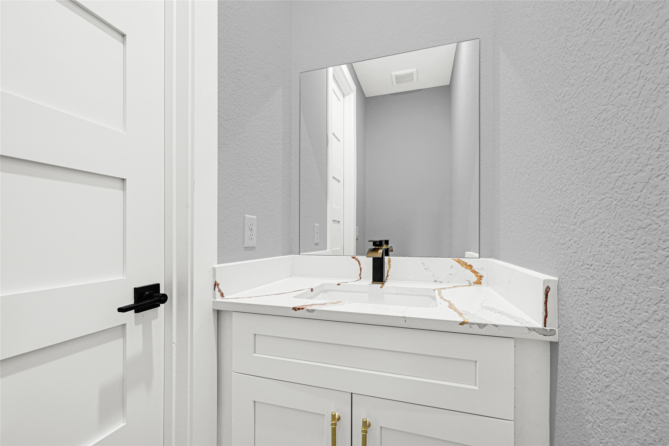 515 Fairfax Lane Conroe, TX 77303 - Photo 18 of 26 a bathroom with a sink and a mirror