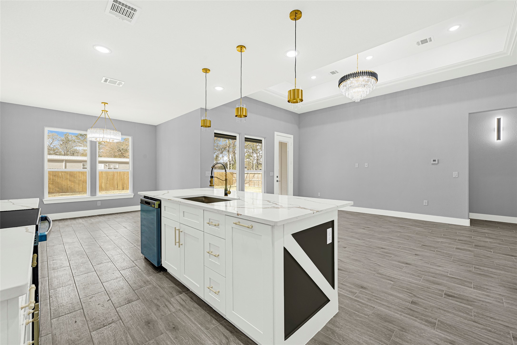 515 Fairfax Lane Conroe, TX 77303 - Photo 7 of 26 a kitchen with a stove and a wooden floor