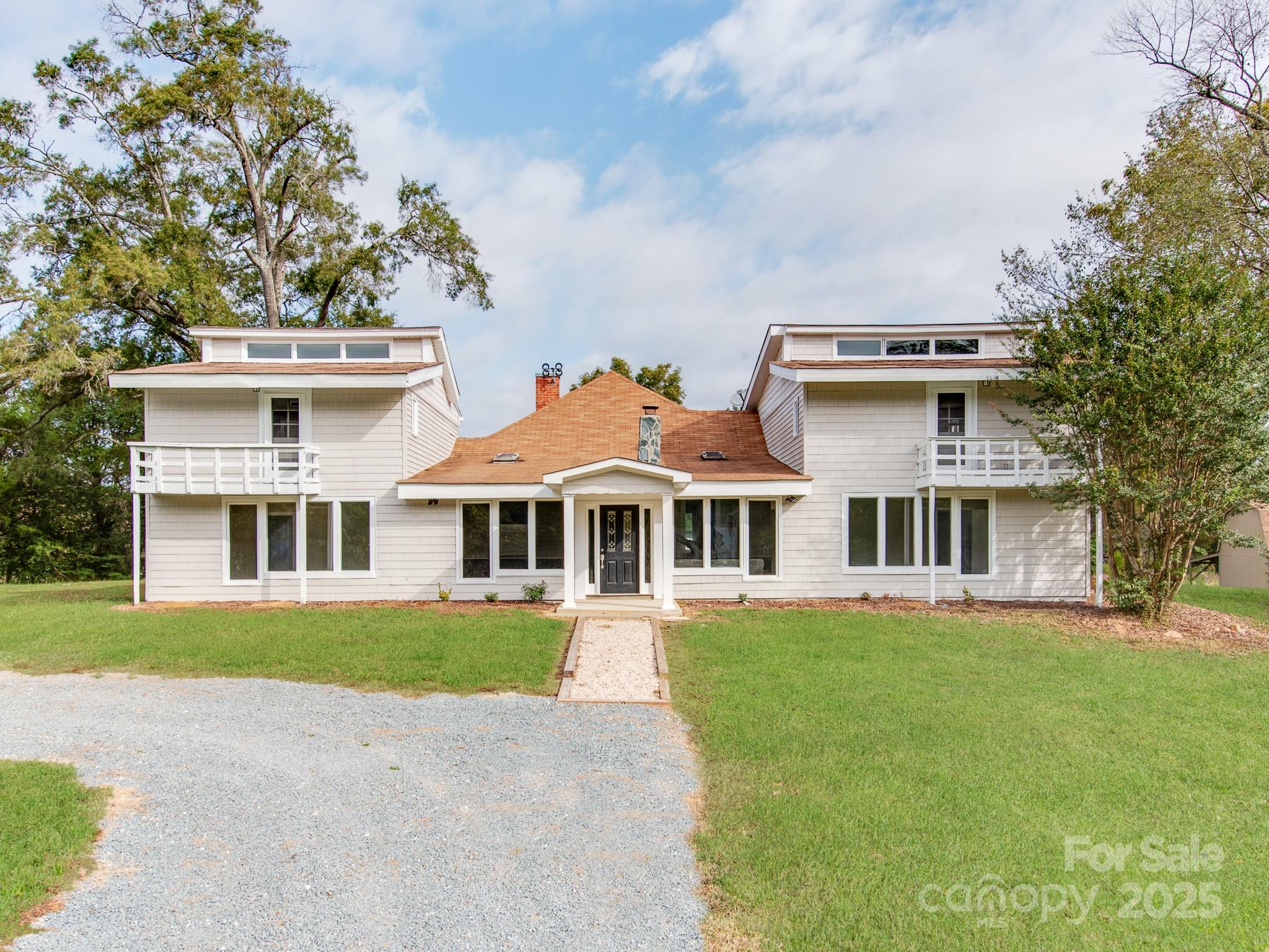 front view of a house with a garden
