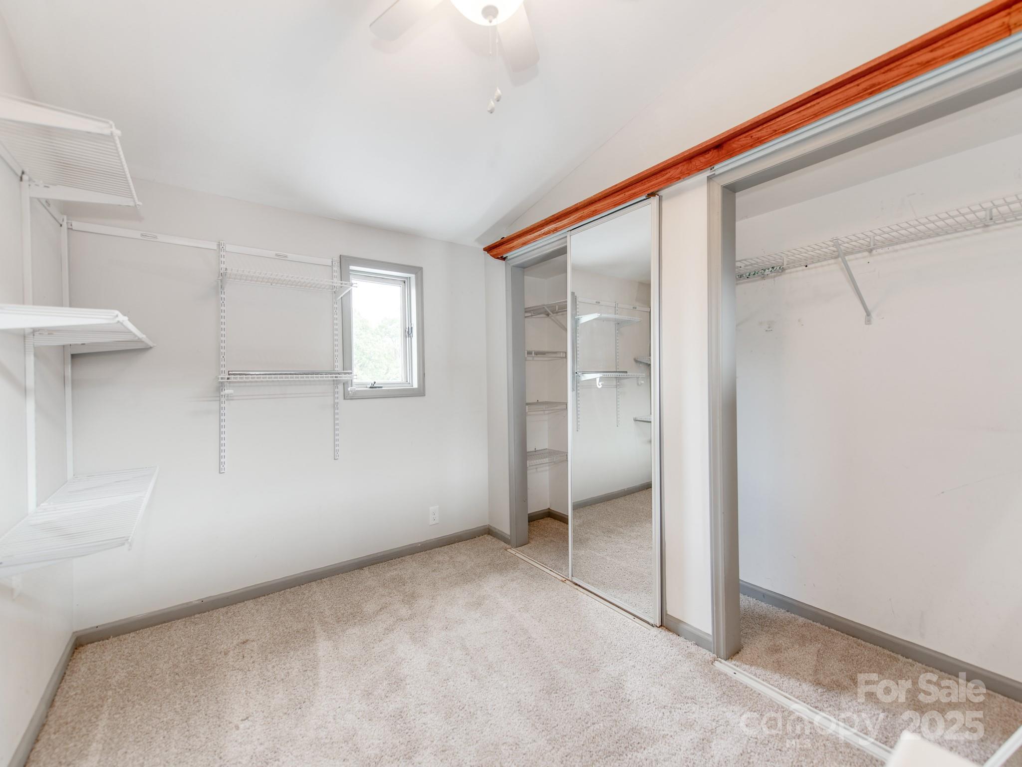 3607 Austin Road Monroe, NC 28112 - Photo 21 of 39 an empty room with windows and closet