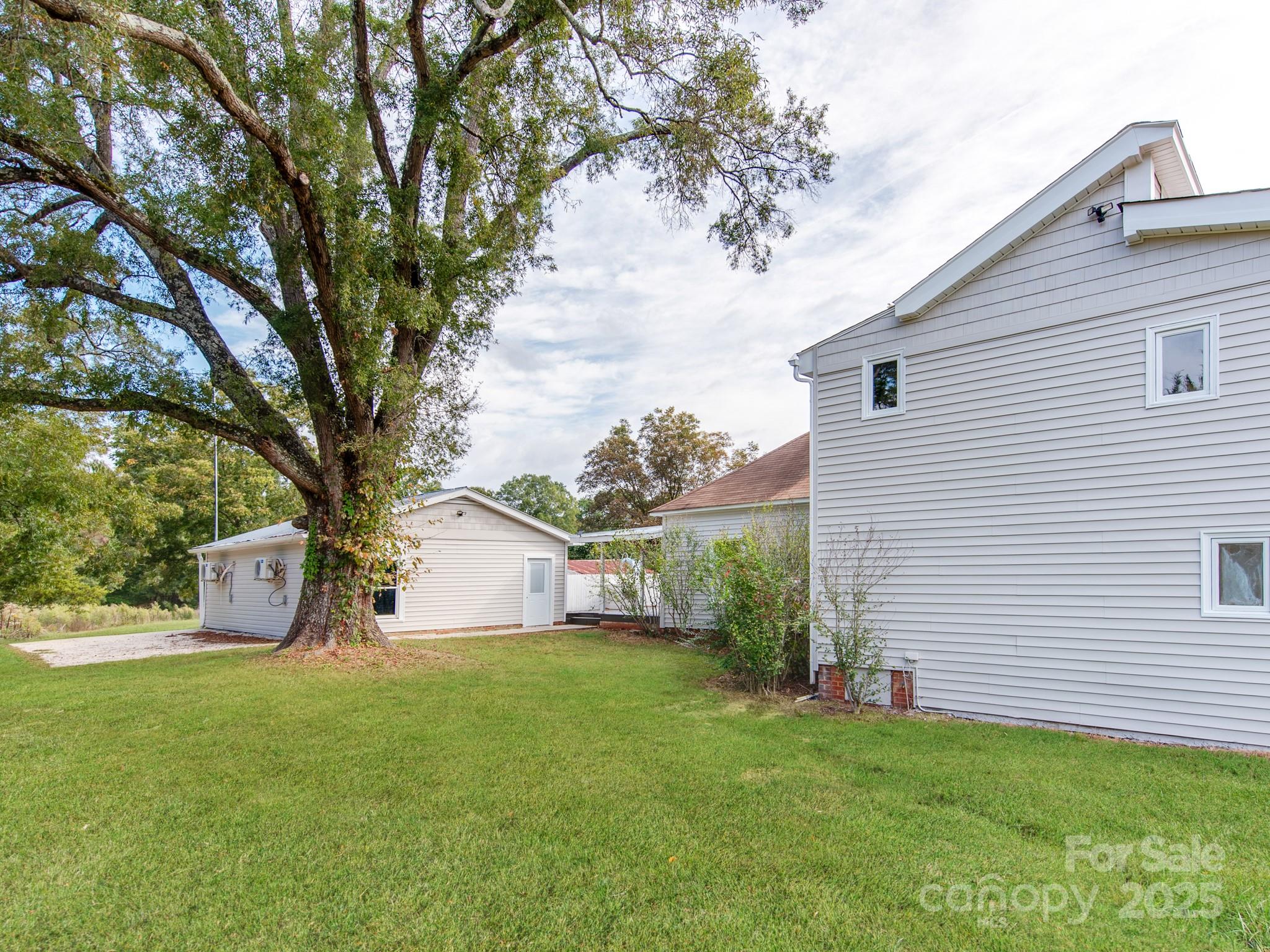 3607 Austin Road Monroe, NC 28112 - Photo 24 of 39 a view of a backyard with a large tree