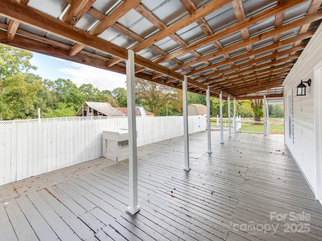 a view of a swimming pool with a patio