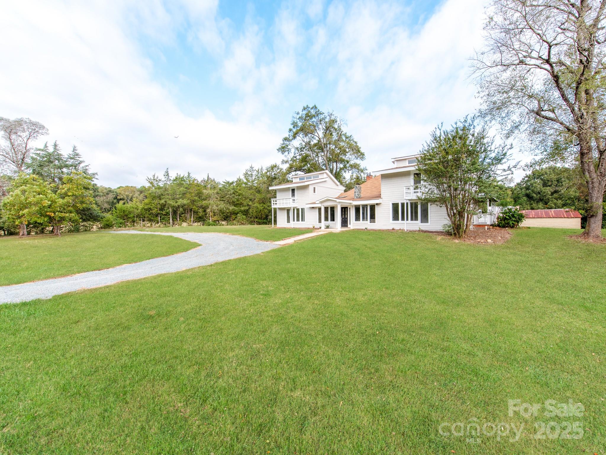 3607 Austin Road Monroe, NC 28112 - Photo 3 of 39 a view of yard with swimming pool and trees in the background
