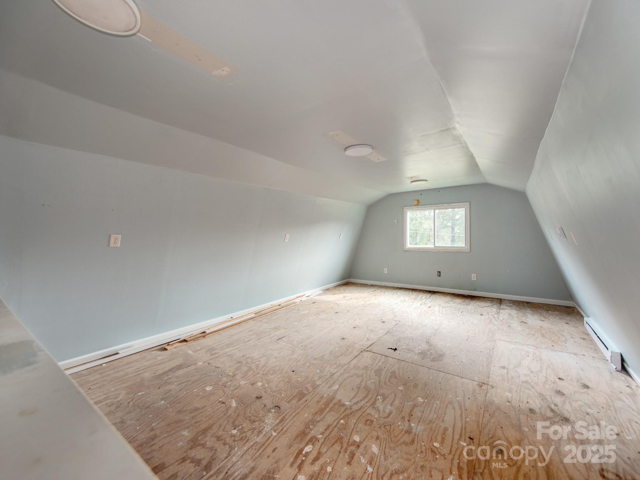 3607 Austin Road Monroe, NC 28112 - Photo 31 of 39 an empty room with a chandeliers and white walls