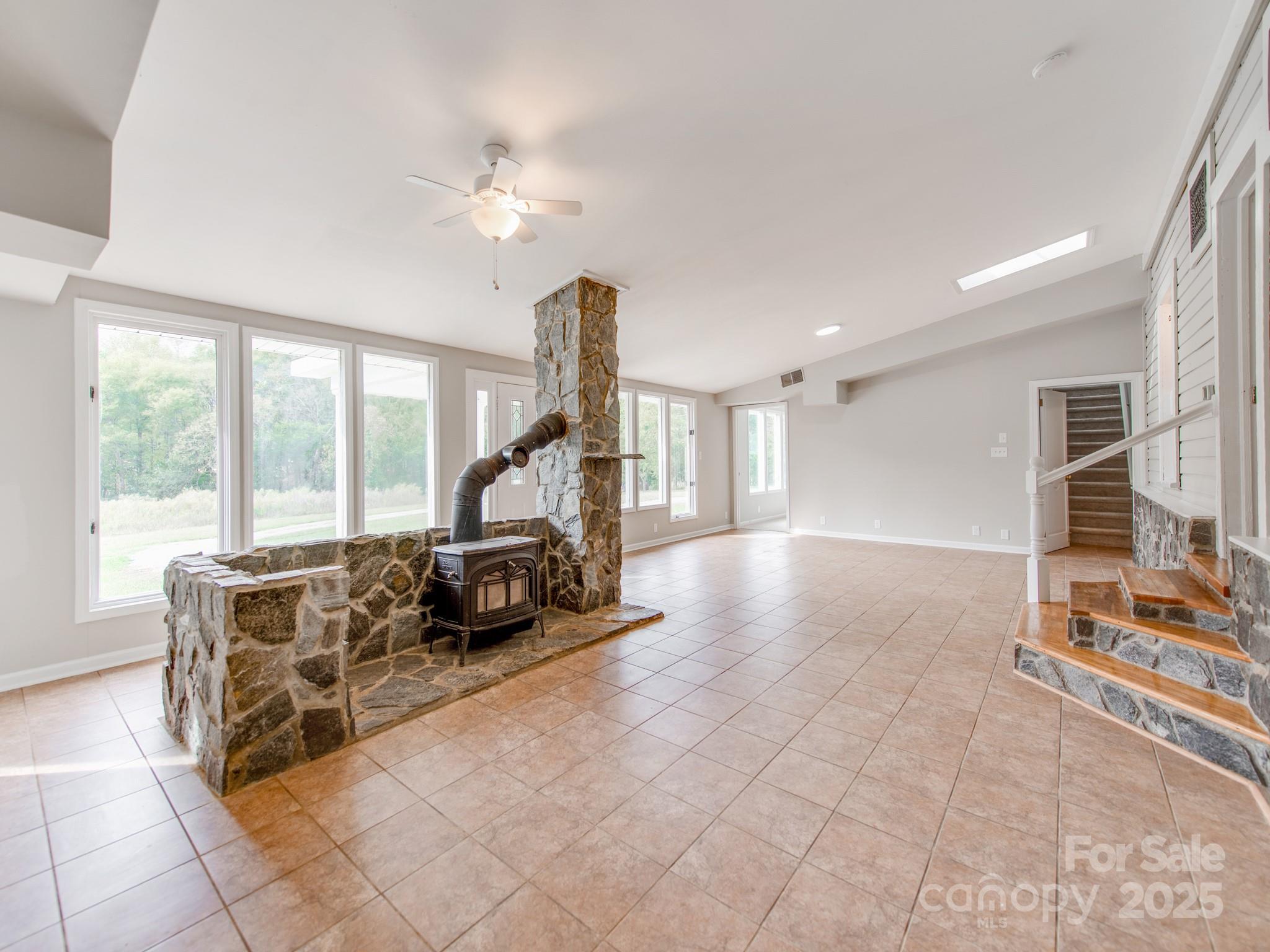 3607 Austin Road Monroe, NC 28112 - Photo 5 of 39 a living room with furniture a large window with table and chairs
