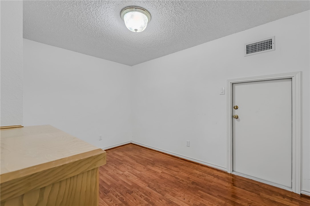 5917 Harvest Hill Road Corpus Christi, TX 78414 - Photo 32 of 40 a view of empty room with wooden floor