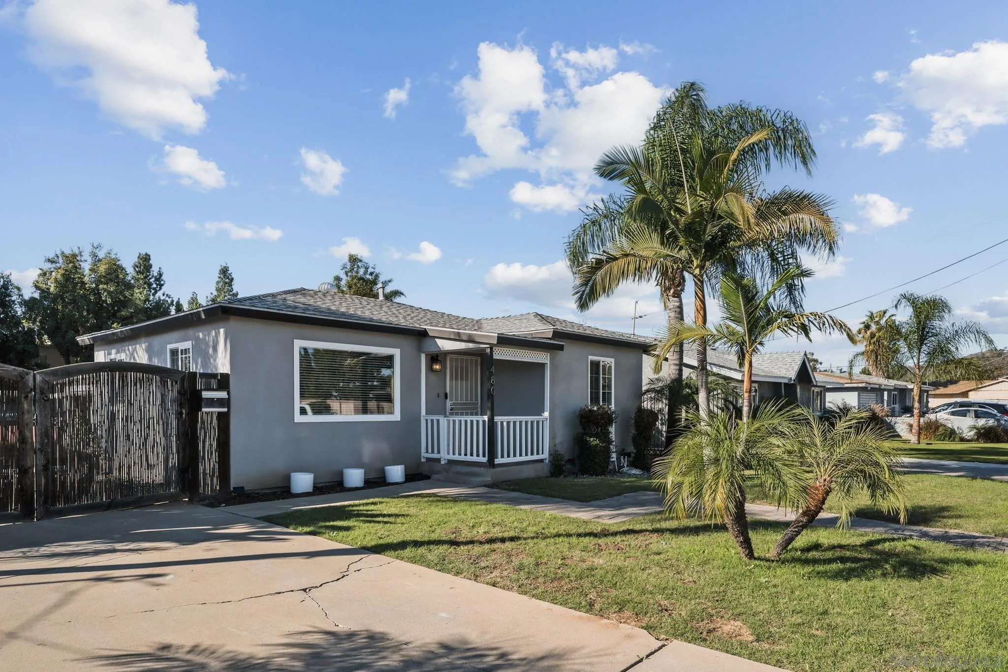 480 Orlando Street El Cajon, CA 92021 - Photo 15 of 25 a view of a house with a yard and palm trees