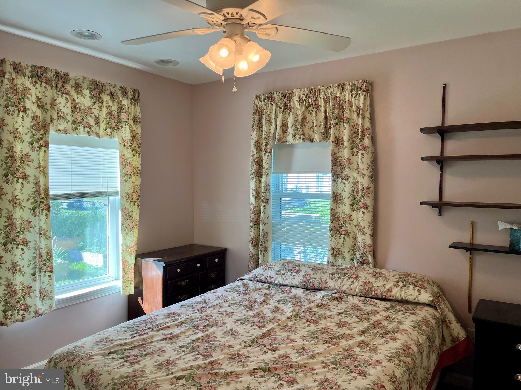 870 Broadfield Drive Newark, DE 19713 - Photo 10 of 13 a bedroom with a bed and a chandelier