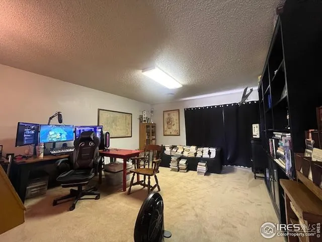 a bedroom with furniture and a flat screen tv