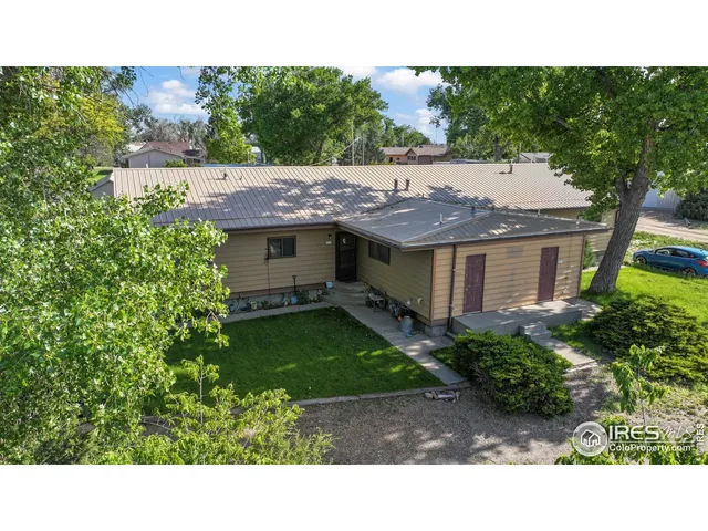 a view of house with a backyard space