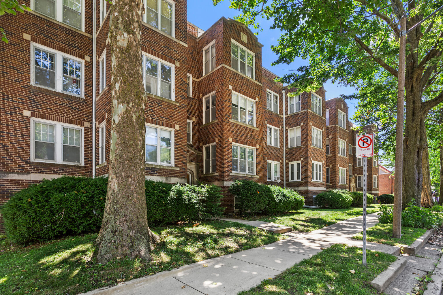 410 North State Street, Unit 4 Champaign, IL 61820 - Photo 2 of 5 a view of a brick building next to a yard