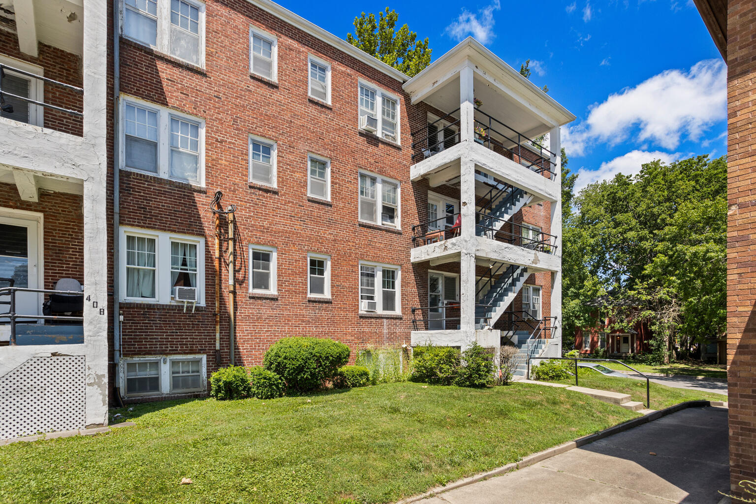 410 North State Street, Unit 4 Champaign, IL 61820 - Photo 3 of 5 front view of a brick house with a yard