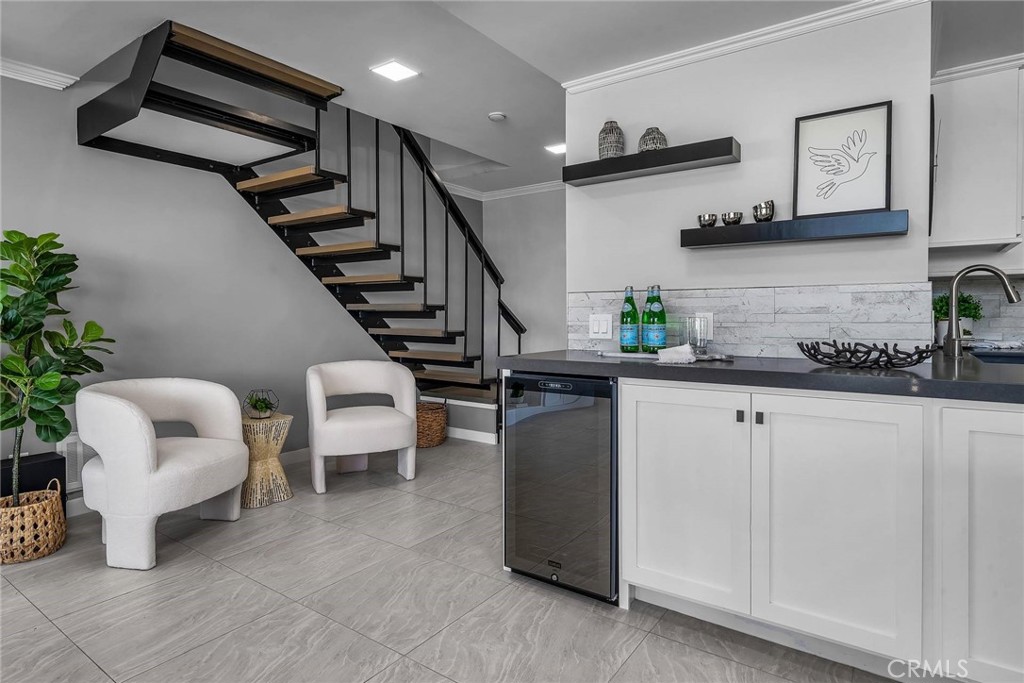 531 Esplanade, Unit 505 Redondo Beach, CA 90277 - Photo 16 of 65 a kitchen with stainless steel appliances kitchen island granite countertop a refrigerator and a white cabinets