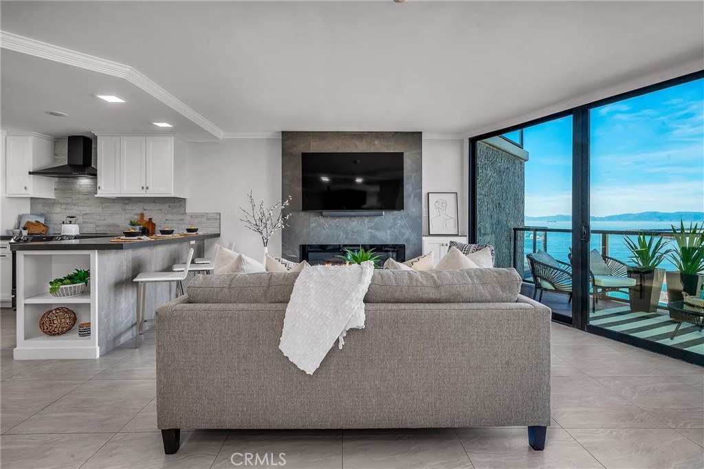 531 Esplanade, Unit 505 Redondo Beach, CA 90277 - Photo 20 of 65 a living room with furniture and a flat screen tv