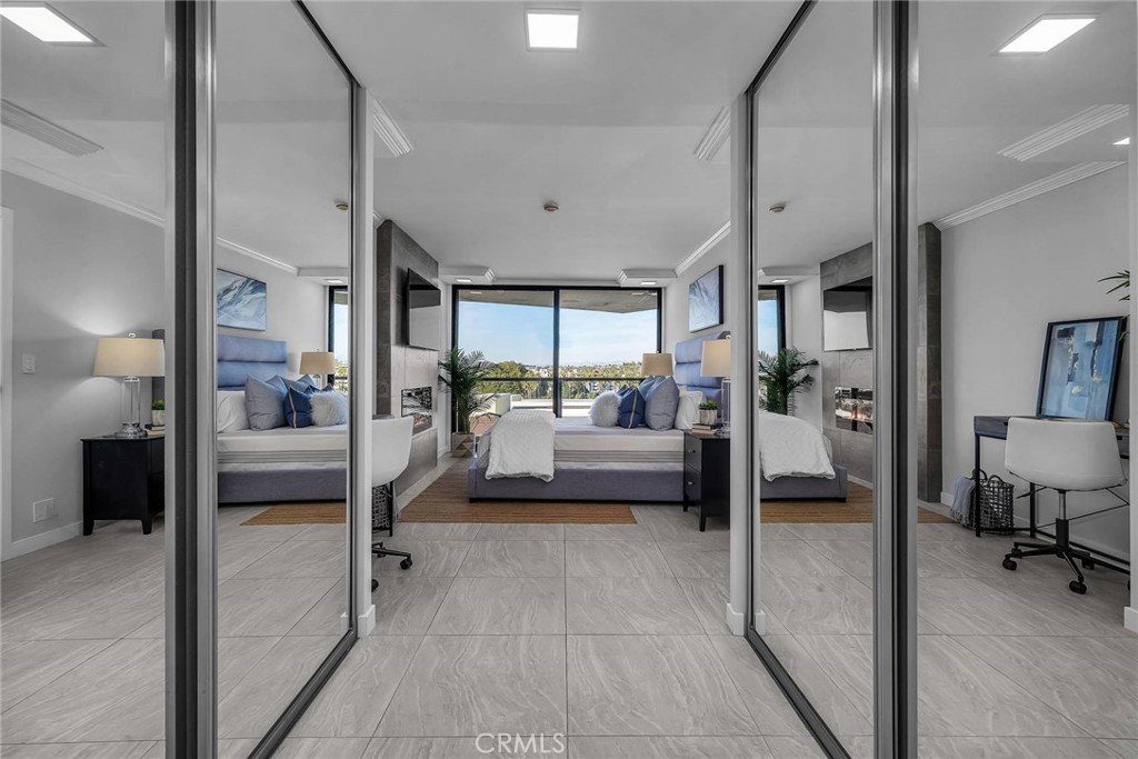 531 Esplanade, Unit 505 Redondo Beach, CA 90277 - Photo 35 of 65 a bedroom with furniture and a large window