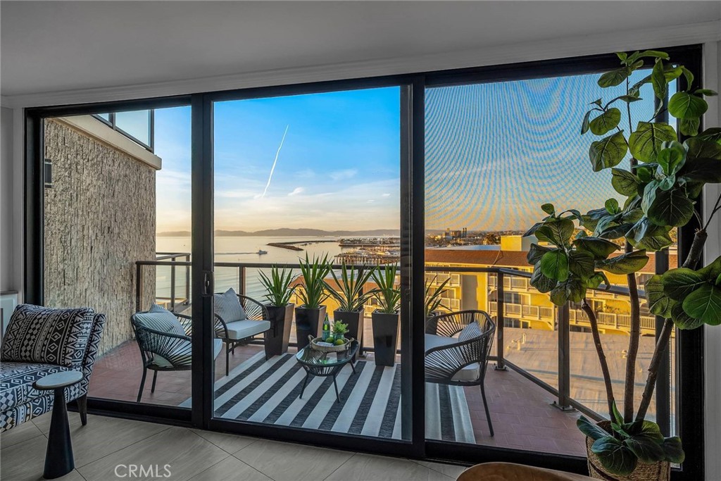 531 Esplanade, Unit 505 Redondo Beach, CA 90277 - Photo 38 of 65 a view of a balcony with chairs and wooden floor
