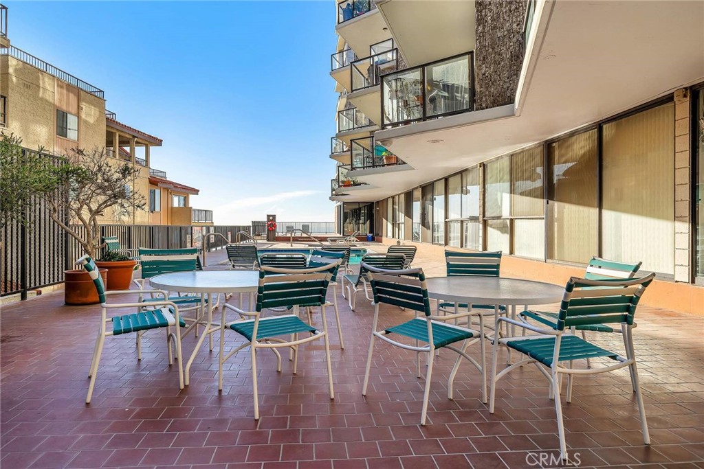 531 Esplanade, Unit 505 Redondo Beach, CA 90277 - Photo 54 of 65 a dinning table and chairs in the patio