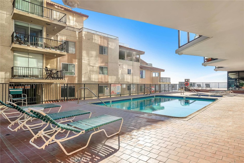 531 Esplanade, Unit 505 Redondo Beach, CA 90277 - Photo 56 of 65 a view of a swimming pool with outdoor seating
