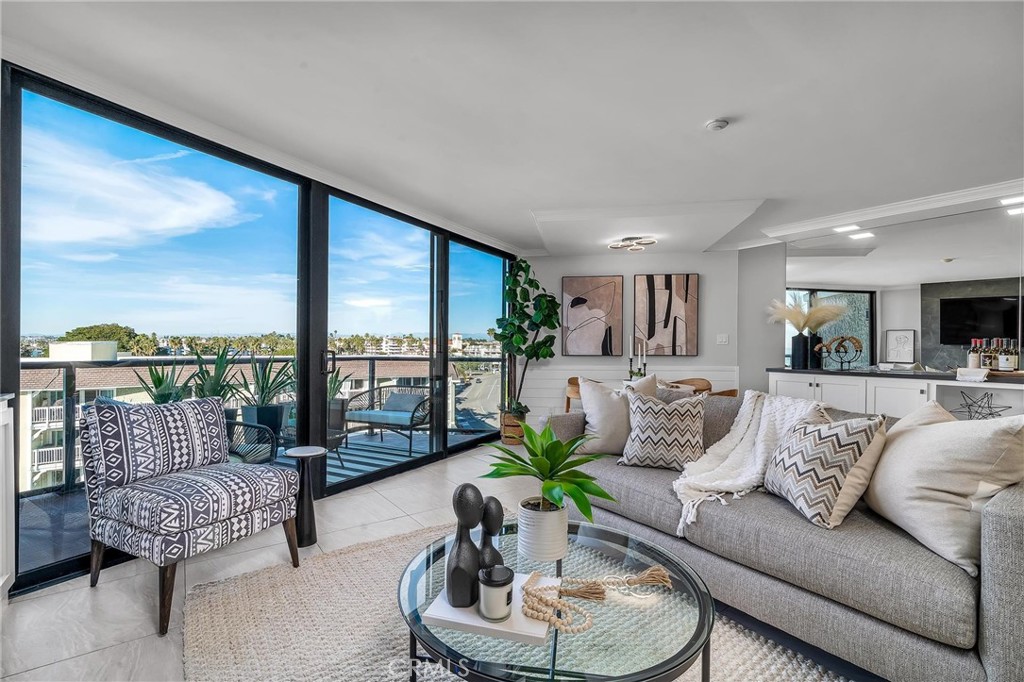 531 Esplanade, Unit 505 Redondo Beach, CA 90277 - Photo 8 of 65 a living room with furniture and a large window