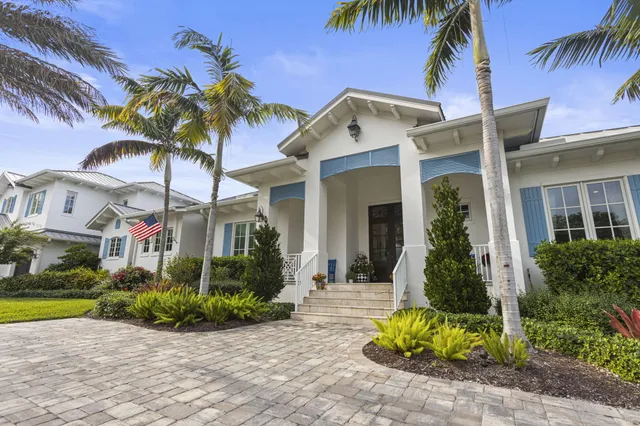 a living room with furniture fireplace and a large window