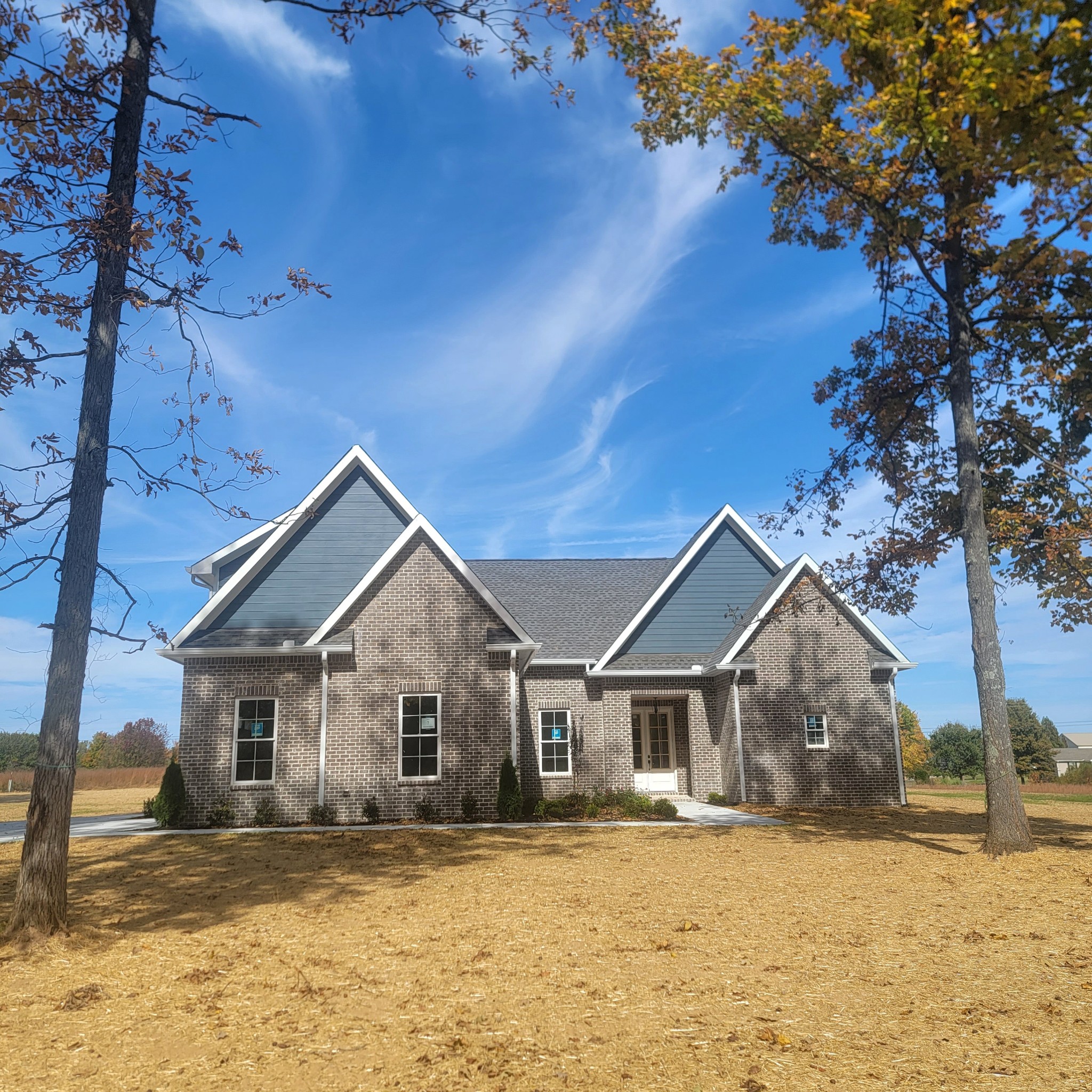 a front view of a house with a yard