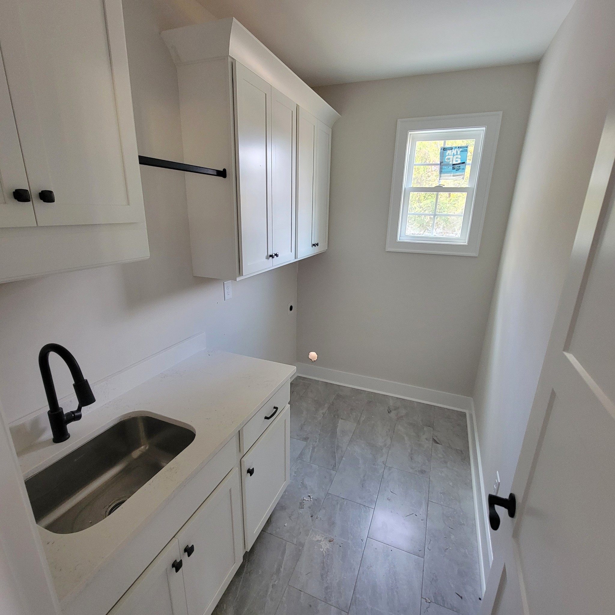 194 Hickory Grove Road Morrison, TN 37357 - Photo 10 of 12 a view of a kitchen with sink and washing machine