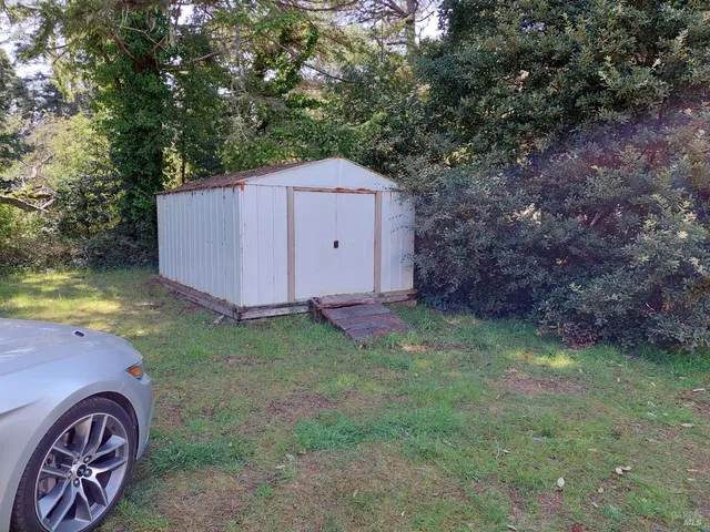 a backyard of a house with lots of green space