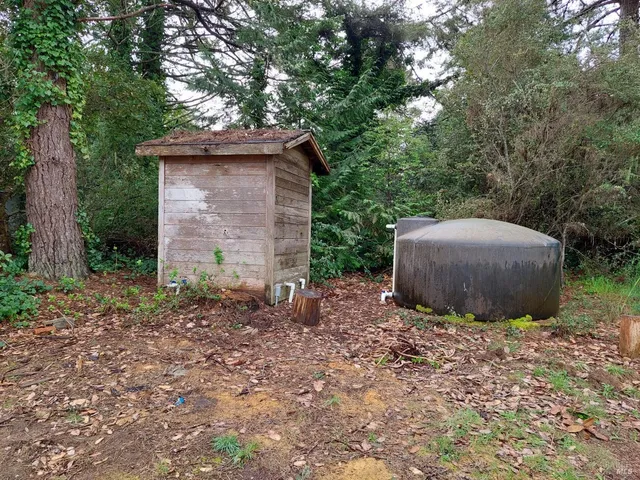 a backyard of a house with lots of green space