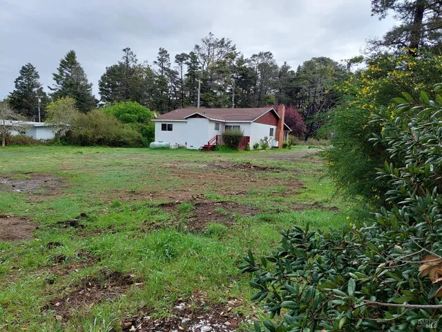 a fire hydrant in the middle of a field