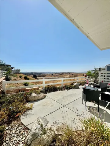 a view of a terrace with wooden floor and seating space