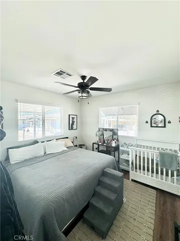 a bedroom with furniture and window