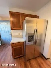 an empty room with wooden floor