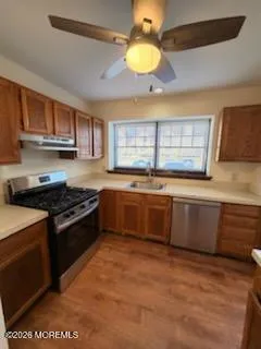 a view of a storage and utility room with washer and dryer