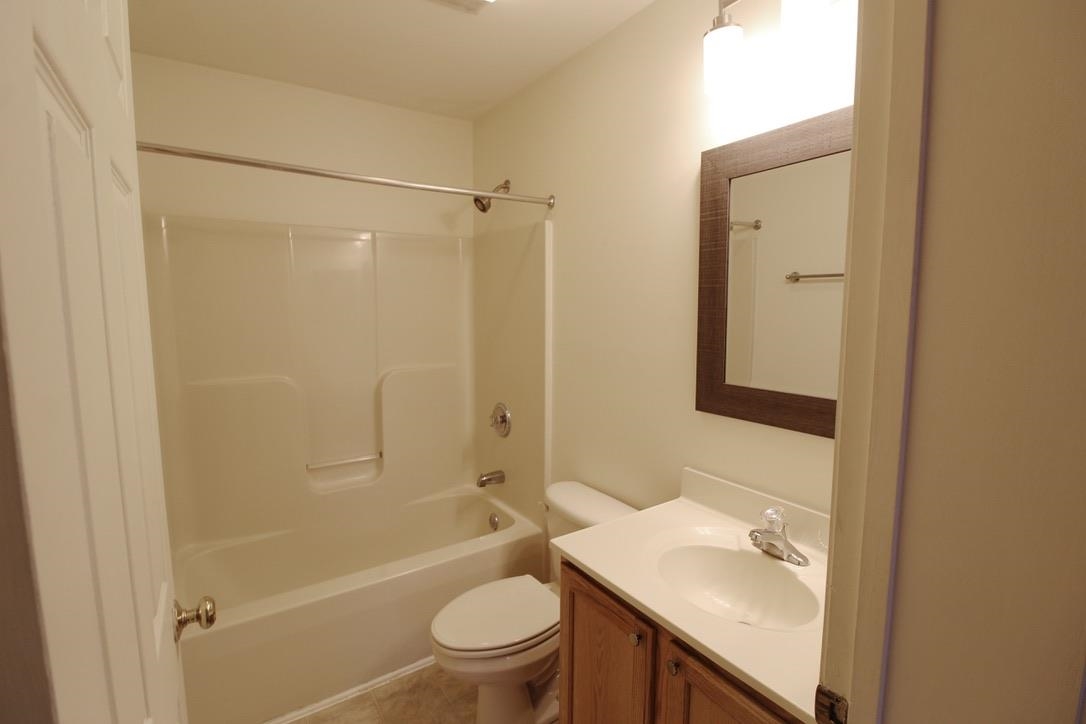 1026 Commercial Court Harrisonburg, VA 22802 - Photo 16 of 16 a bathroom with a sink a toilet and shower