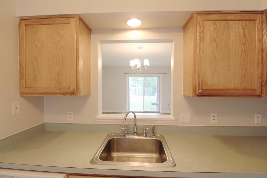 1026 Commercial Court Harrisonburg, VA 22802 - Photo 3 of 16 a bathroom with a sink and a mirror