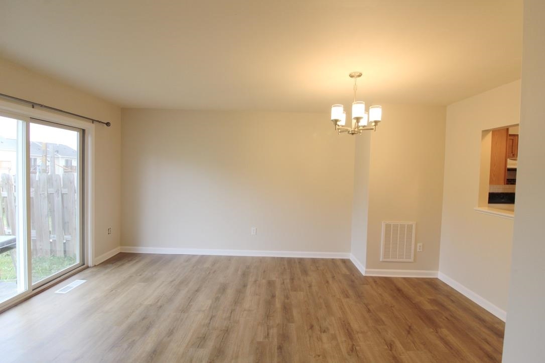 1026 Commercial Court Harrisonburg, VA 22802 - Photo 6 of 16 wooden floor in an empty room with a window