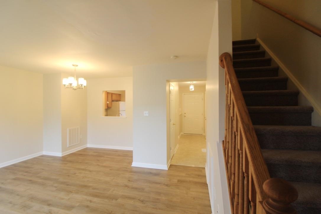 1026 Commercial Court Harrisonburg, VA 22802 - Photo 8 of 16 a view of an entryway with wooden floor and stairs