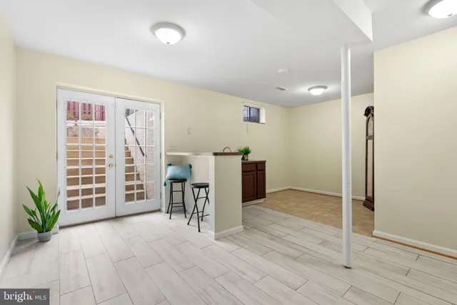 an empty room with furniture and windows