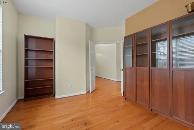 a view of closet area with empty racks