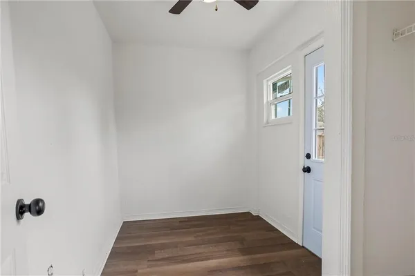 a view of a livingroom with wooden floor