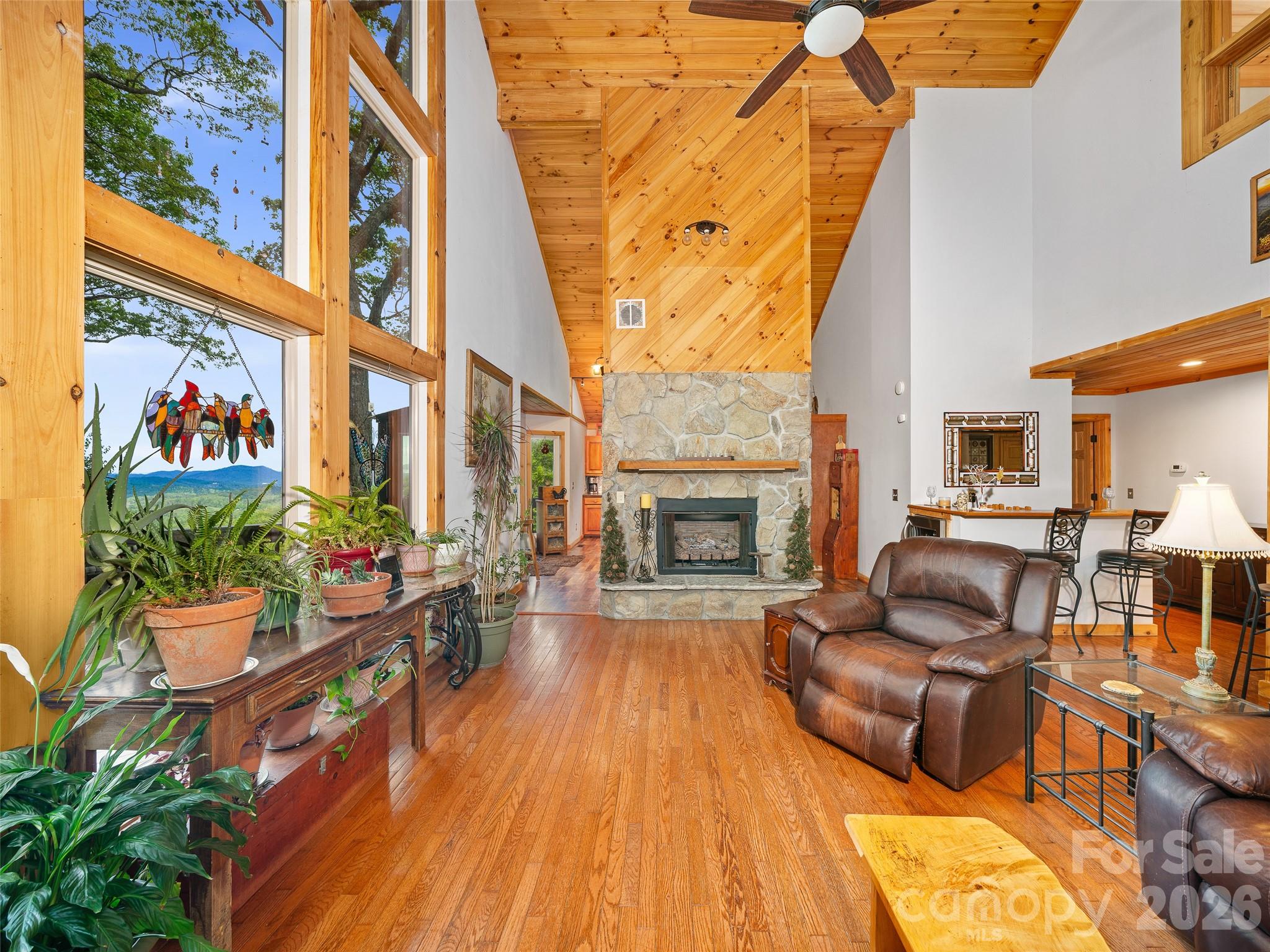 228 Continental Divide Road Spruce Pine, NC 28777 - Photo 3 of 48 a living room with furniture and a fireplace