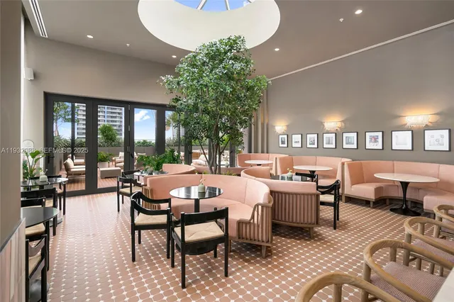 a bedroom with two beds and a flat screen tv