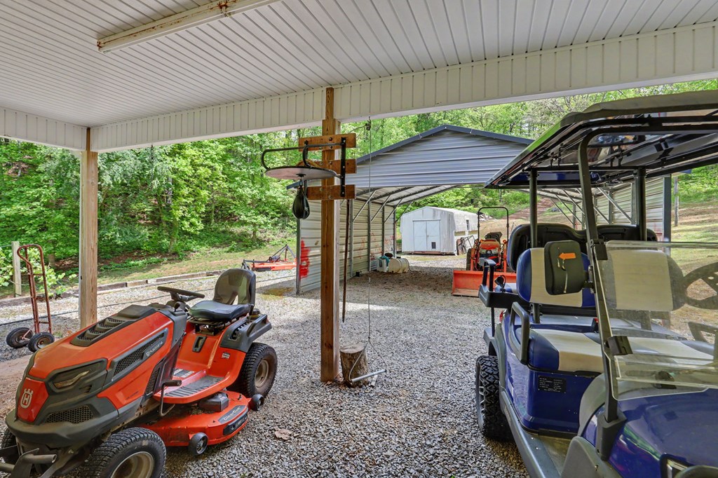 522 Fred Amos Road Murphy, NC 28906 - Photo 14 of 73 a view of a patio with table and chairs under an umbrella