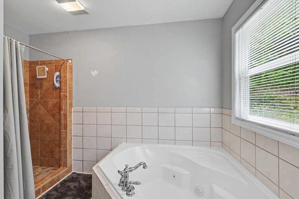 522 Fred Amos Road Murphy, NC 28906 - Photo 51 of 73 a bathroom with a tub and shower