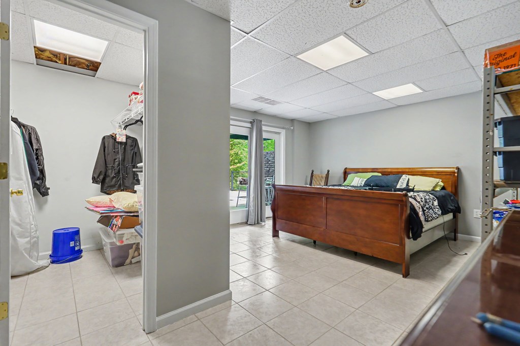 522 Fred Amos Road Murphy, NC 28906 - Photo 68 of 73 a bedroom with furniture and a lamp