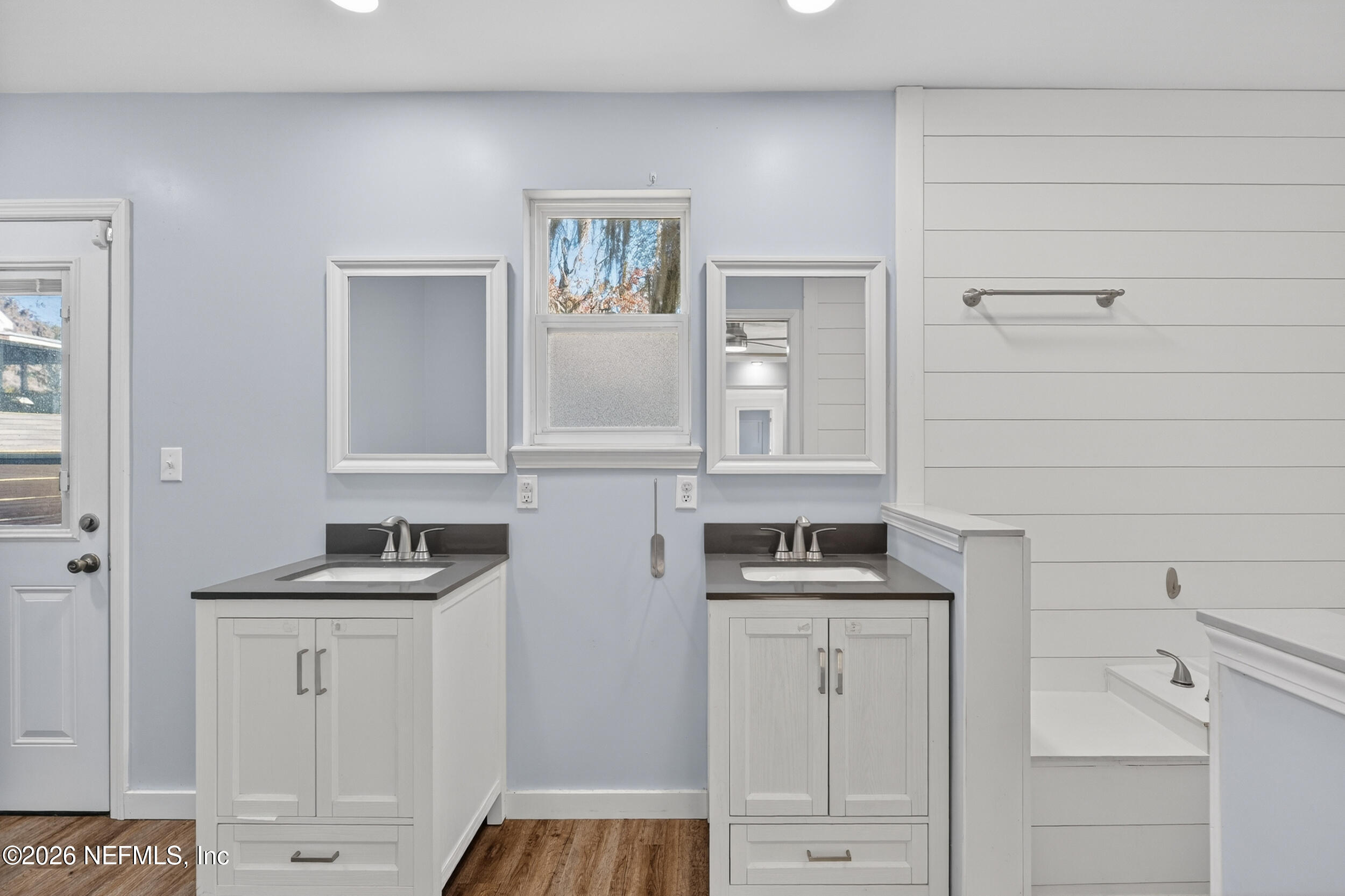 228 Southeast 66th Street Starke, FL 32091 - Photo 16 of 39 a kitchen with white cabinets and sink