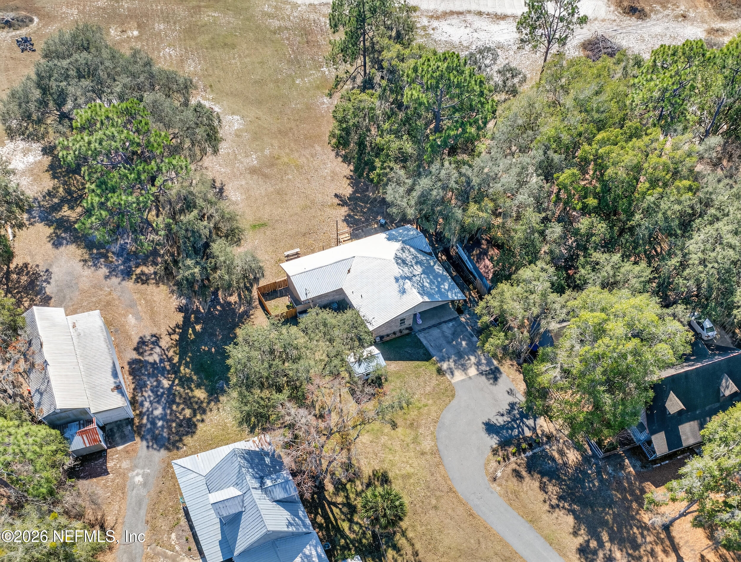 228 Southeast 66th Street Starke, FL 32091 - Photo 35 of 39 an aerial view of a house with a yard and lake view