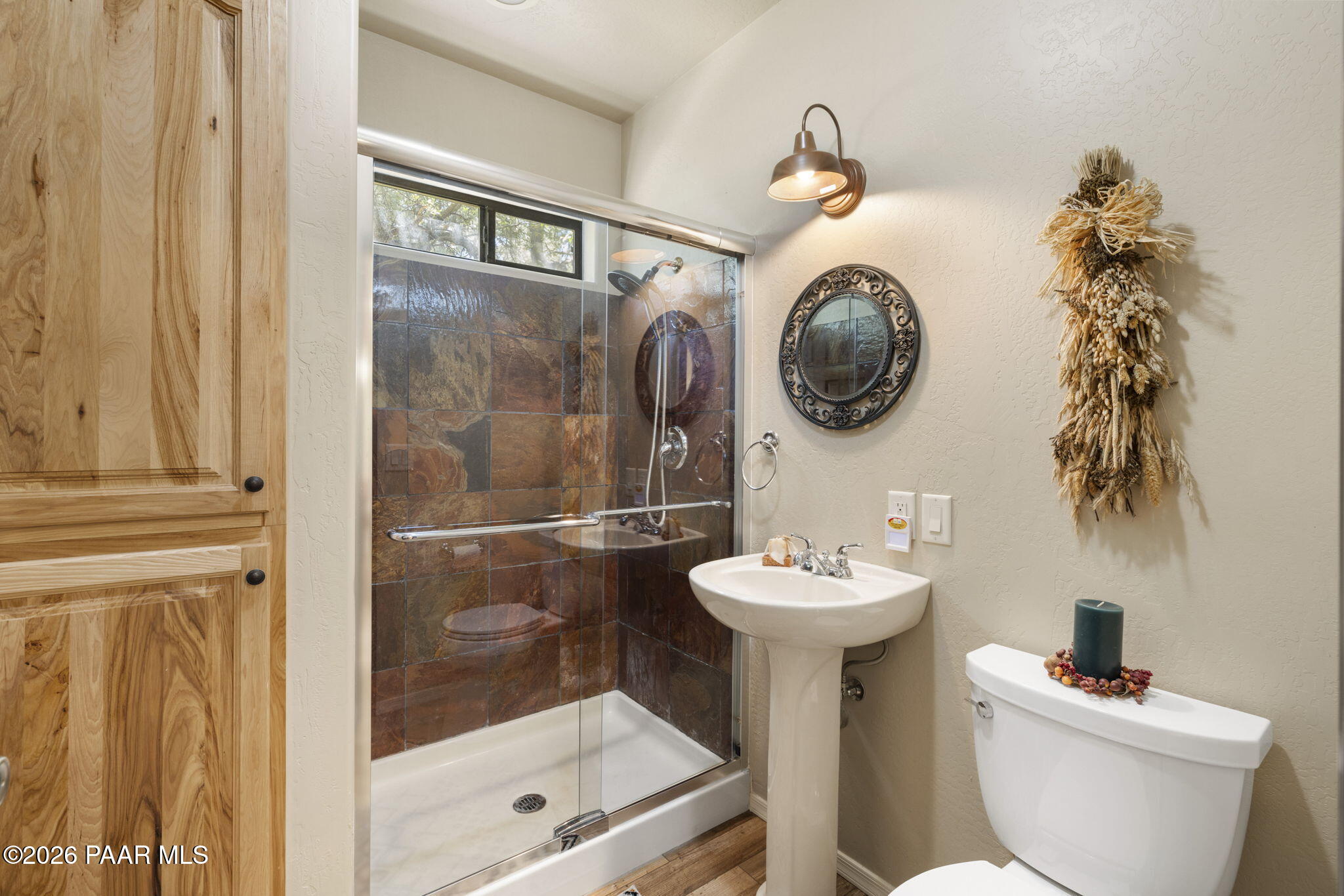535 Copper Basin Road Prescott, AZ 86303 - Photo 19 of 41 a bathroom with a sink mirror toilet and shower